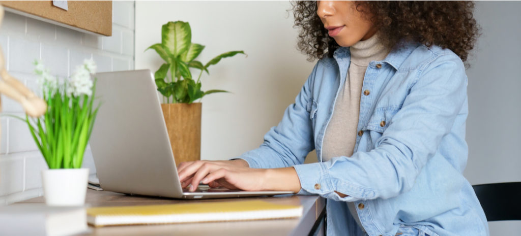 young woman student freelancer distance worker using laptop