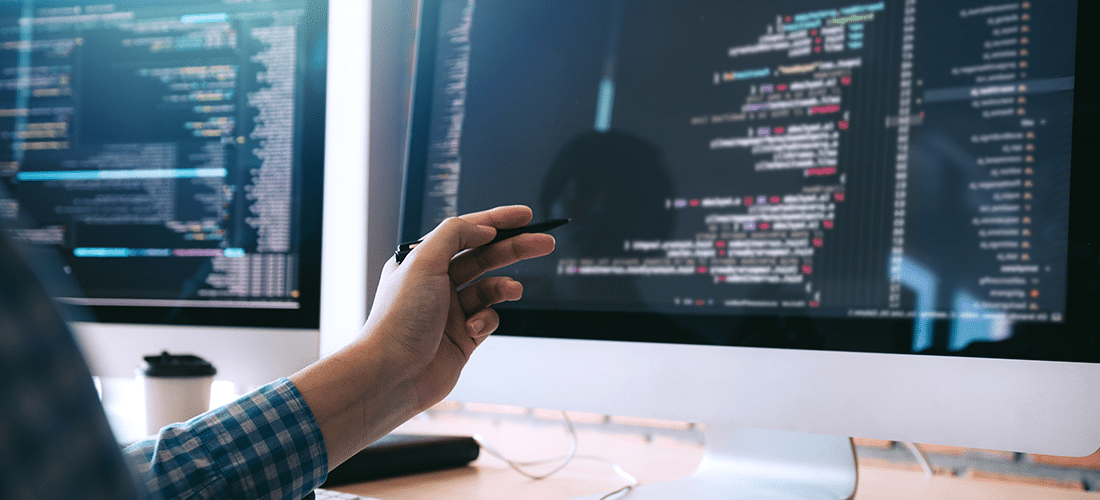How To Use Ajax in WordPress. a person checks their code on a Mac desktop