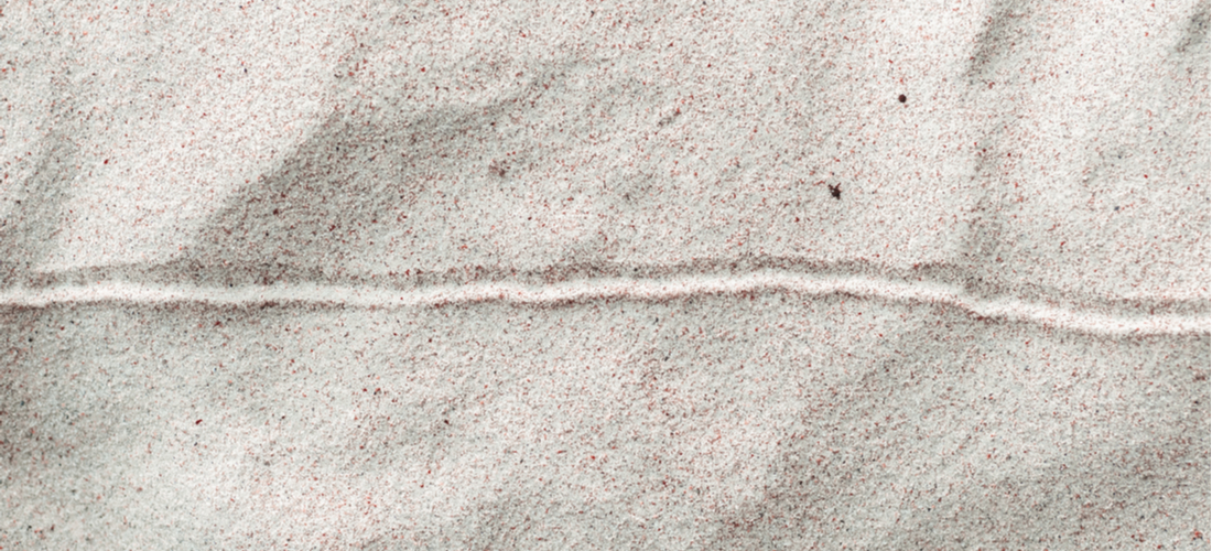 Image of a horizontal line drawn in the sand