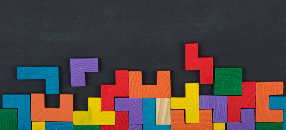 Picture of colorful puzzle blocks fitting together in integration