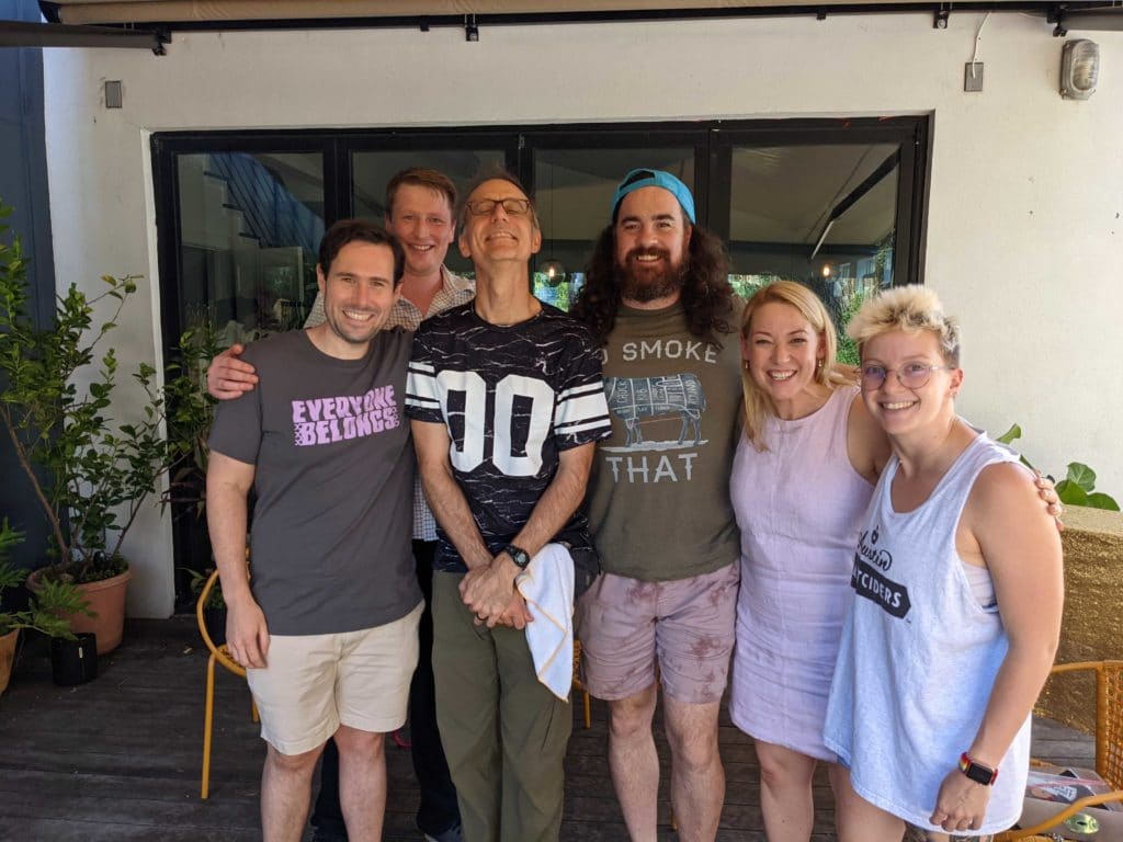 Austin employees smile for a picture during a Pride week event