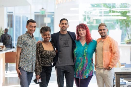 Participants pose for a photo at a StartOut event