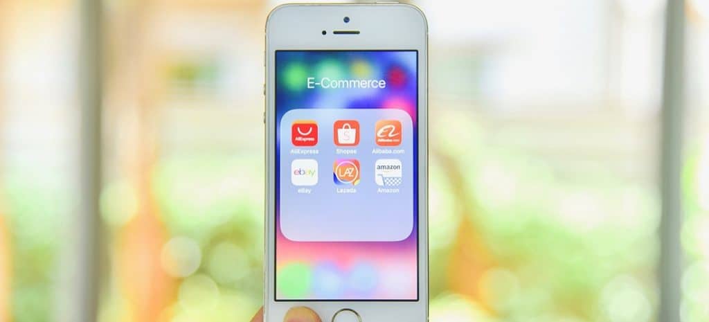 Hand Holding Smartphone with eCommerce Applications