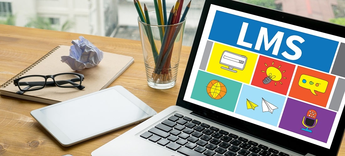 Laptop on table with LMS open