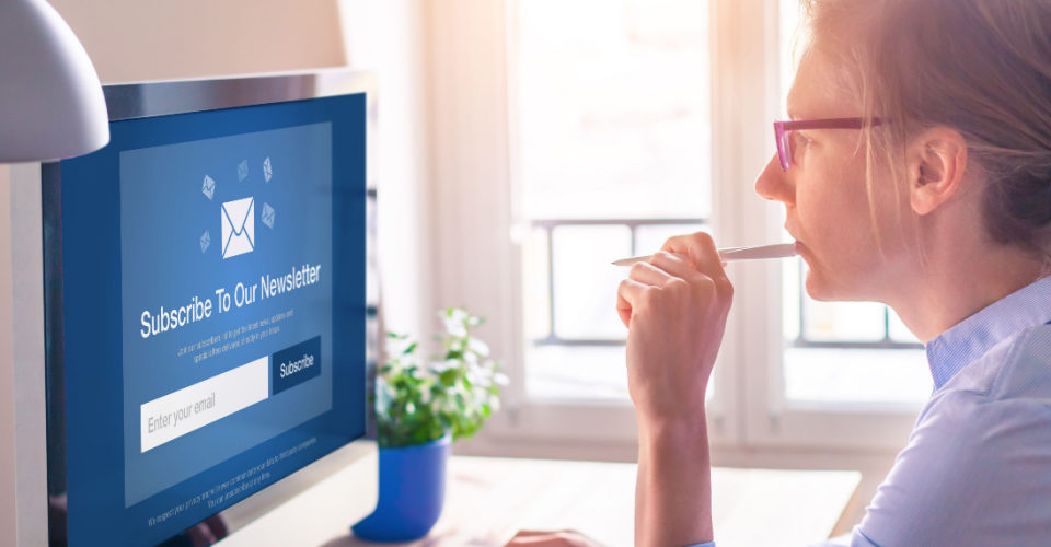 woman looking at computer screen