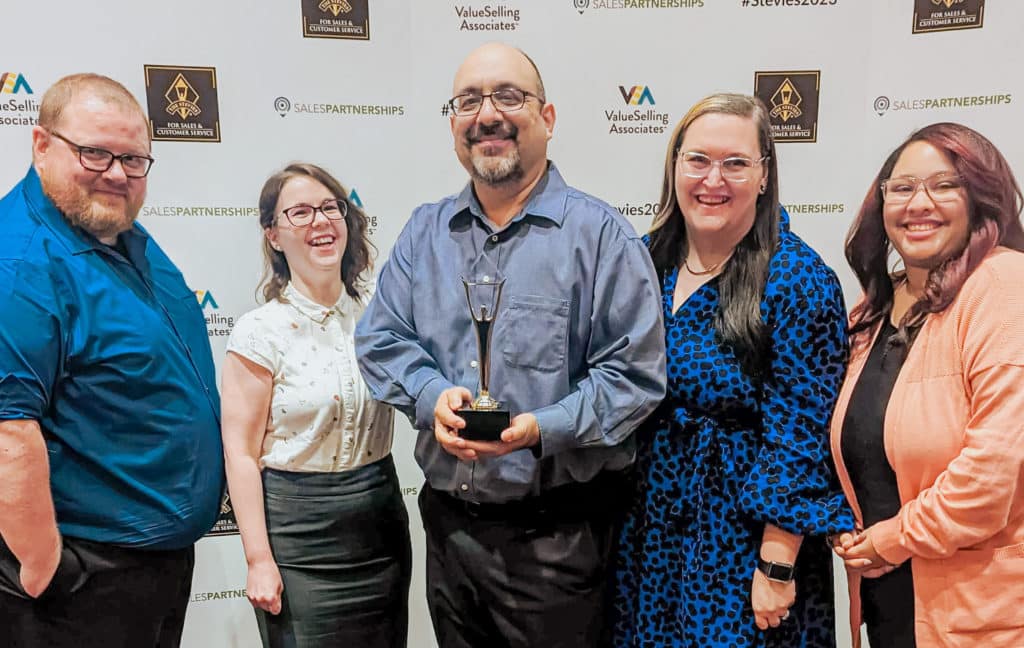 Bob Beltran, WP Engine VP of Technical Support, holds the Silver Stevie Award won by WP Engine’s Customer Support team, flanked by some of his senior Support leaders 