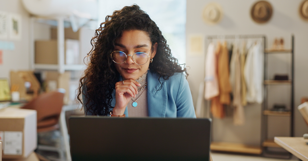 eCommerce store owner on laptop improving WooCommerce product recommendations
