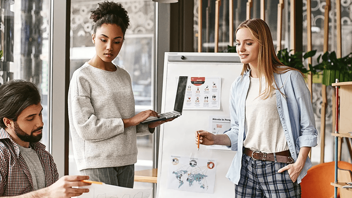 A creative meeting between three professionals. Headless architecture for agencies can streamline workflows while providing unique, memorable experiences for clients.